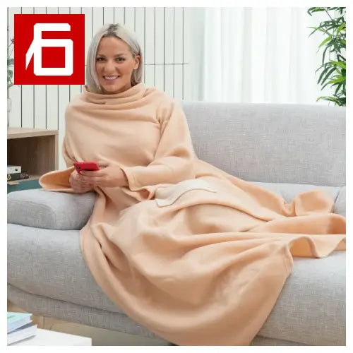 Peach-colored wearable blanket with maniche singola e tasca centrale per massimo comfort
