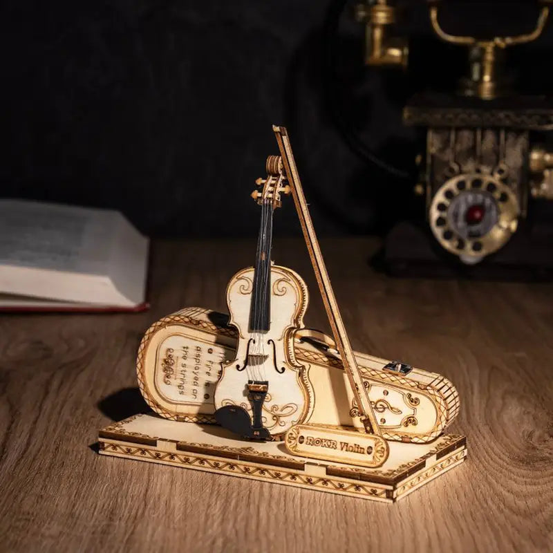 Miniature wooden violin on stand for the VoxPuzzle Violin 3D Puzzle.