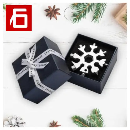 A Black Box With a Snowflake And a White Ribbon