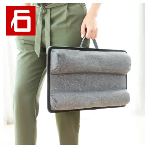 Handle in hand on XL Deskion padded grey laptop sleeve, perfect for the laptop desk.