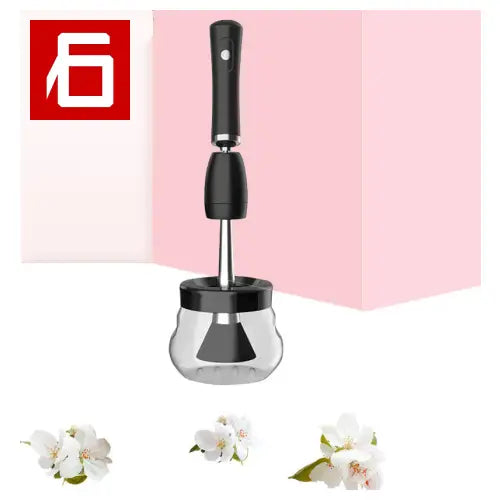 A Pink And Black Blender With a Pink Background